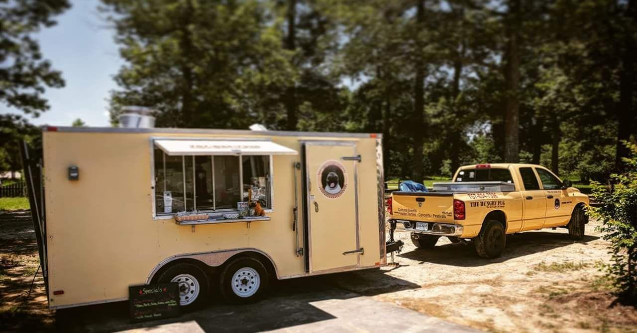 Yellow Hungry Pug Food Truck with photo of pug pulled by yellow truck