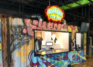5 Fun Williamsburg Restaurants Precarious Beer Hall food stand serving tacos and nachos from an indoor converted shipping container featuring colorful street-style graffiti